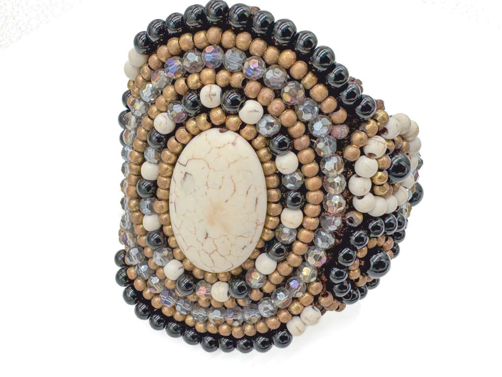 HANDCRAFTED - UNUSUAL GLASS AND BEAD BRACELET ON HEAVY BRAIDED BASE