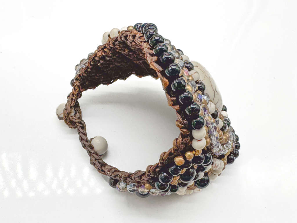 HANDCRAFTED - UNUSUAL GLASS AND BEAD BRACELET ON HEAVY BRAIDED BASE