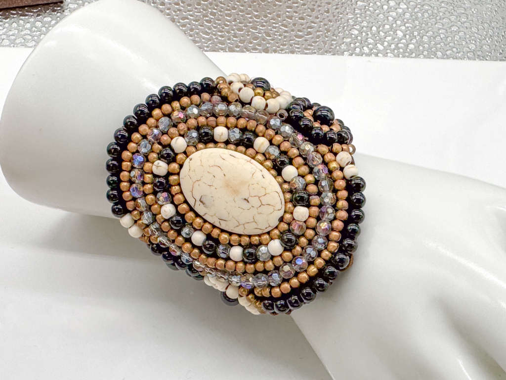 HANDCRAFTED - UNUSUAL GLASS AND BEAD BRACELET ON HEAVY BRAIDED BASE