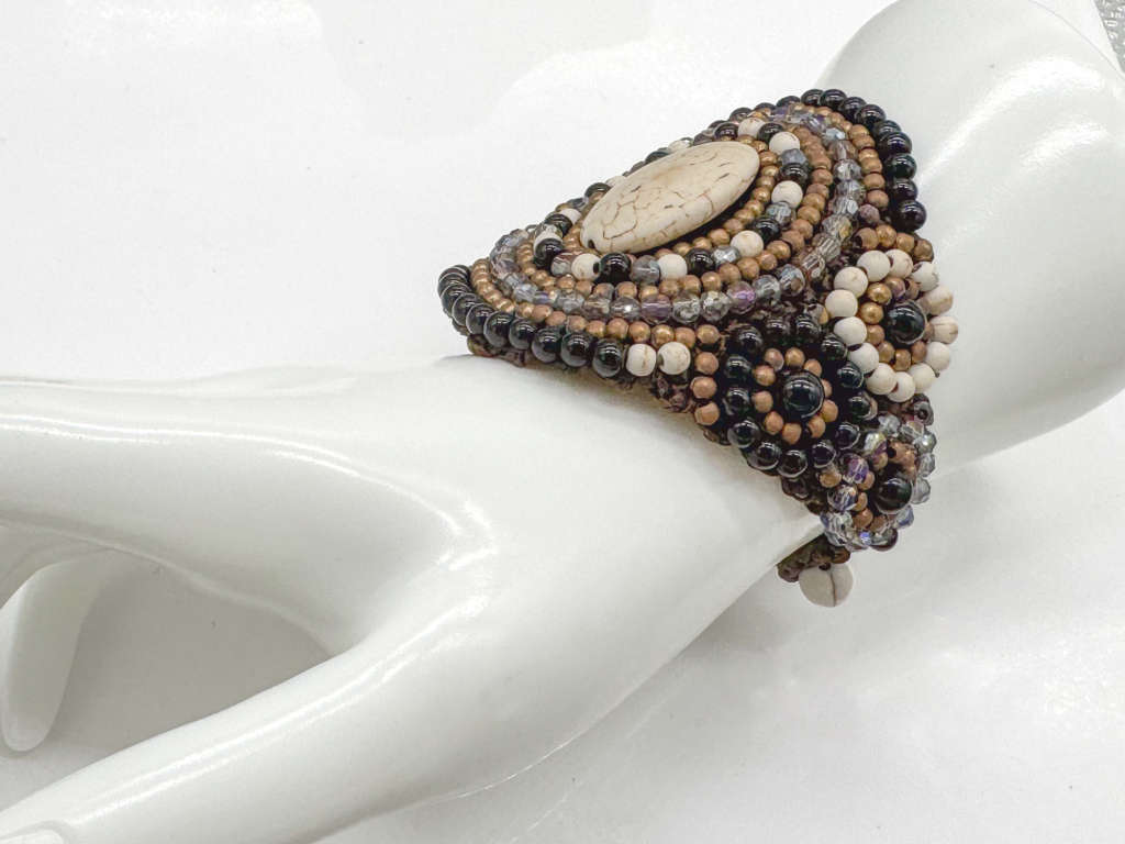 HANDCRAFTED - UNUSUAL GLASS AND BEAD BRACELET ON HEAVY BRAIDED BASE