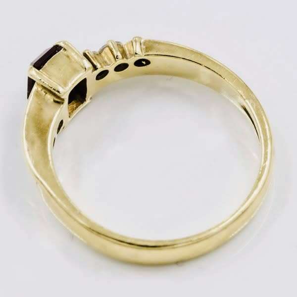 SOLID 9CT YELLOW GOLD GARNET AND CUBIC ZIRCONIA RING WITH R8`500 JEWELLER EVALUATION CERT