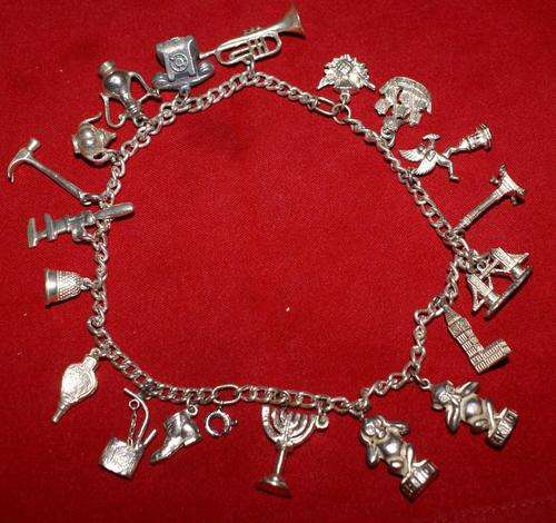 Vintage Silver Charms on silver chain - 19 diff charms, total weight 75gms