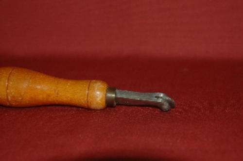 Embossing tool for leather, gold foil application. Wheel runs well.