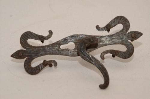 An ornate metal door handle