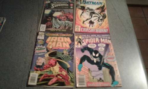 SUPERMAN ,BATMAN,SPIDERMAN, AND IRON MAN COMIC BOOKS.