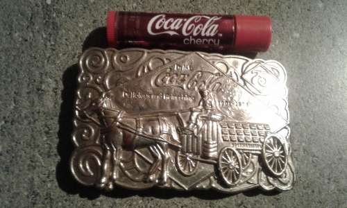 COCA COLA BERGAMOT 1976 75 TH ANNIVERSARY 1901--1975 BRASS BELT BUCKLE. LIP BALM.