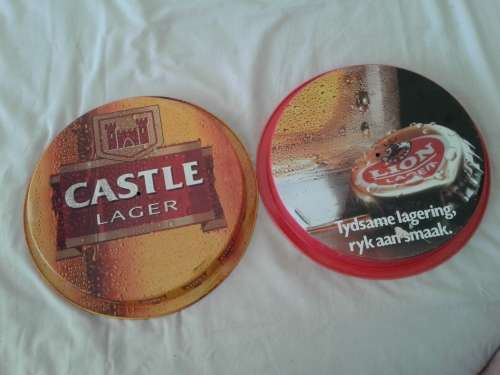 AUTHENTIC CASTLE -- AND LION LAGER BI-LINGUAL PUB SERVING TRAYS. GOOD CONDITION.
