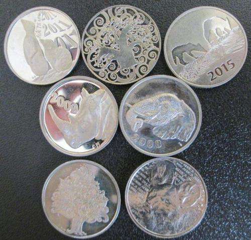 7 different Coin World Tokens