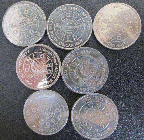 7 different Coin World Tokens