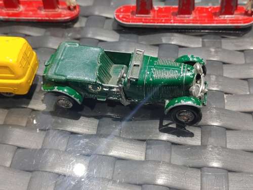 Antique lesney bentley and evening news van with feul stands made in england