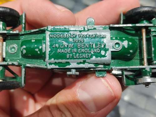 Antique lesney bentley and evening news van with feul stands made in england