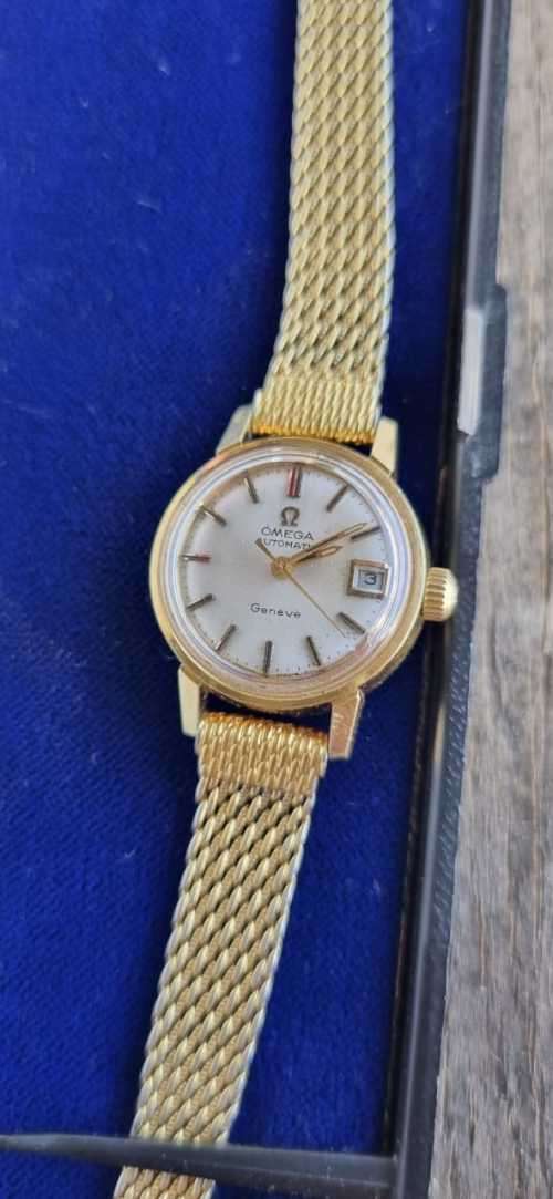 1945 omega automatic geneve 566.002 ladies watch with Fischer 14kt rolled gold strap