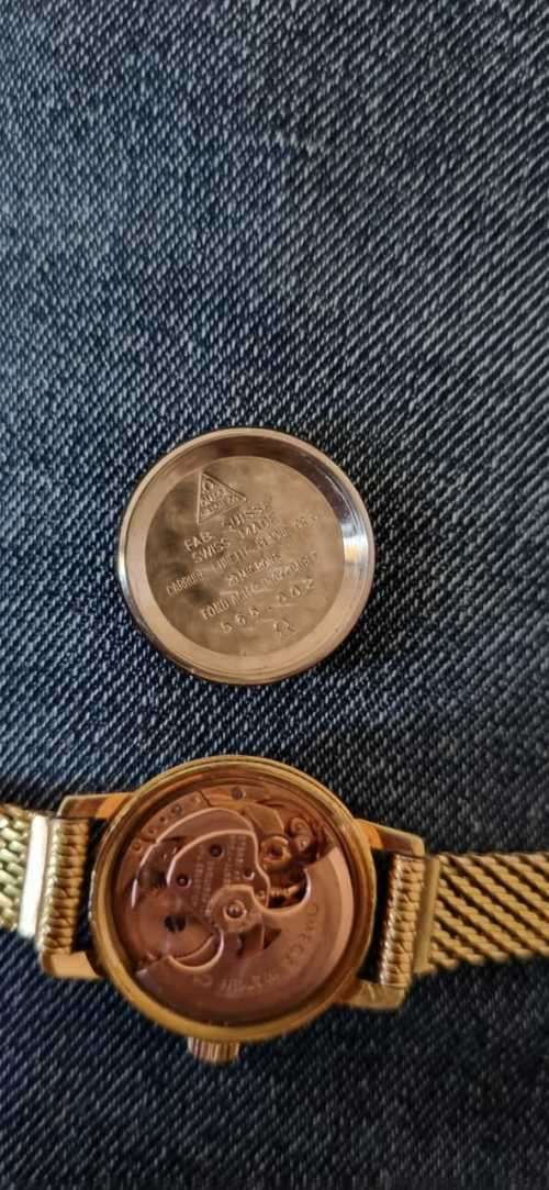 1945 omega automatic geneve 566.002 ladies watch with Fischer 14kt rolled gold strap