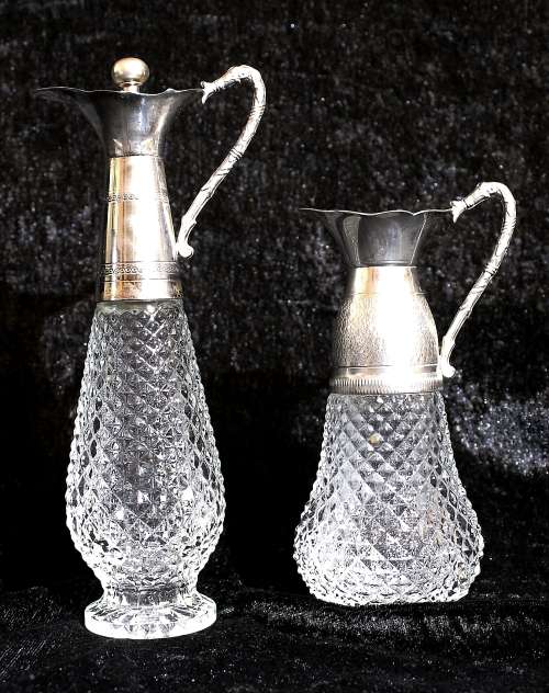 Vintage pair of glass and silver plate vinegar and oil cruets
