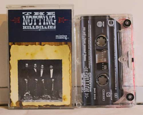 THE NOTTING HILLBILLIES-Missing...presumed having a good time 1990 UK cassette