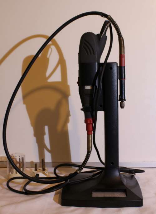 Rotary drill with flexible shaft and stand