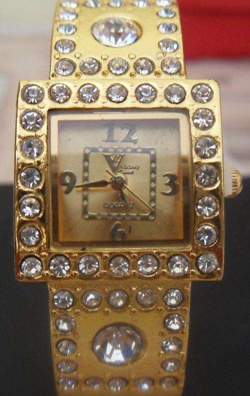 Gold watch with diamante - bangle style