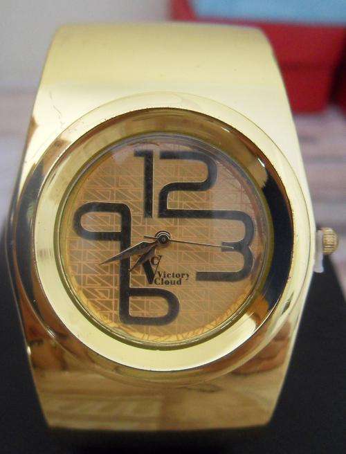Gold watch with big numbers - bangle style