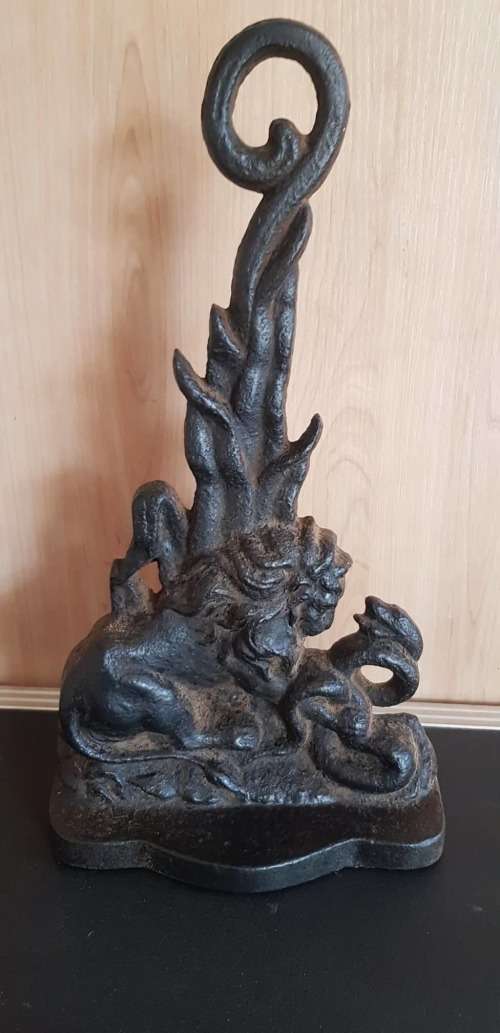 CIRCA 1880 BRITISH LION AND SNAKE CAST IRON DOOR STOP.