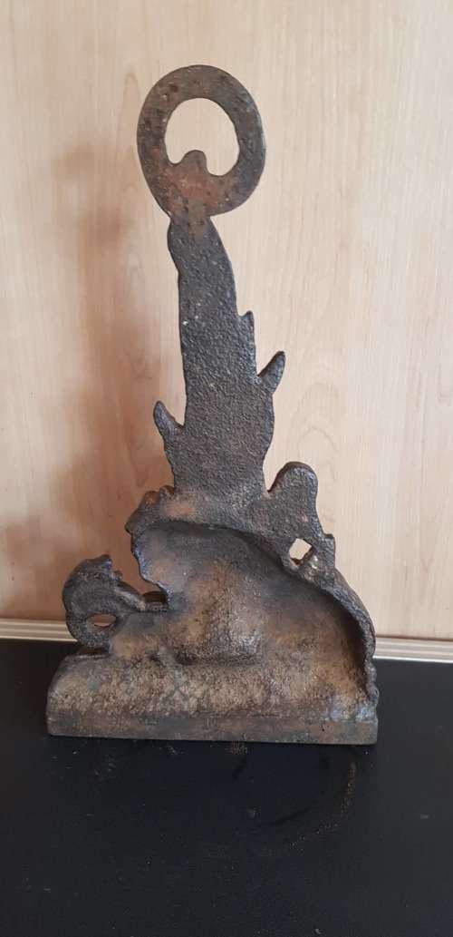 CIRCA 1880 BRITISH LION AND SNAKE CAST IRON DOOR STOP.