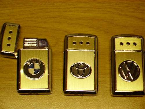 STAINLESS STEEL CIGARETTE LIGHTERS - TOYOTA / BMW / VW. REFILLABLE GAS. SUPERB QUALITY.