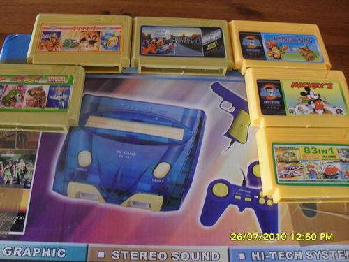 Home gaming console with controlls, gun ang  game cartridges