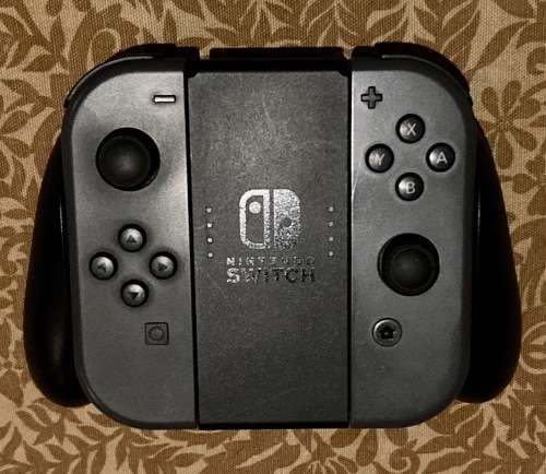 grey Nintendo Switch Joy-Con pair with Grip