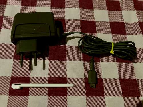 green Nintendo DS Lite with charger and stylus