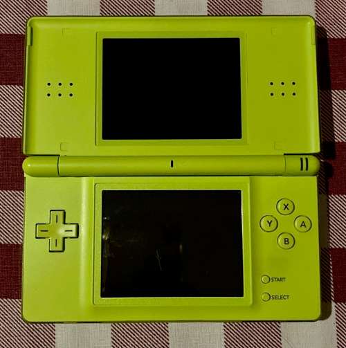green Nintendo DS Lite with charger and stylus