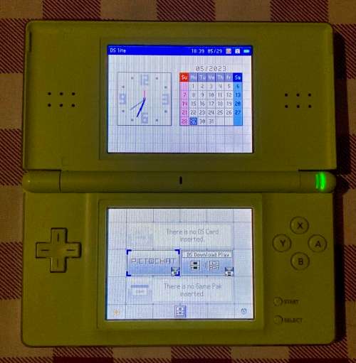 green Nintendo DS Lite with charger and stylus