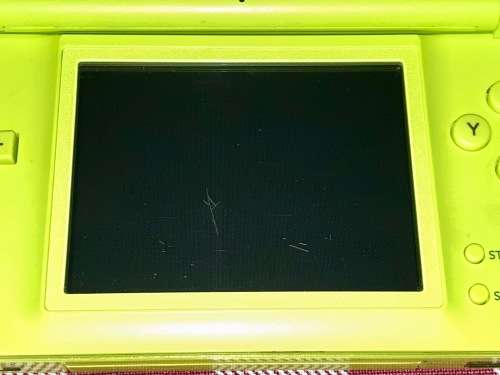 green Nintendo DS Lite with charger and stylus