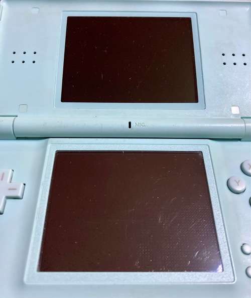 light blue Nintendo DS Lite with charger, stylus & case