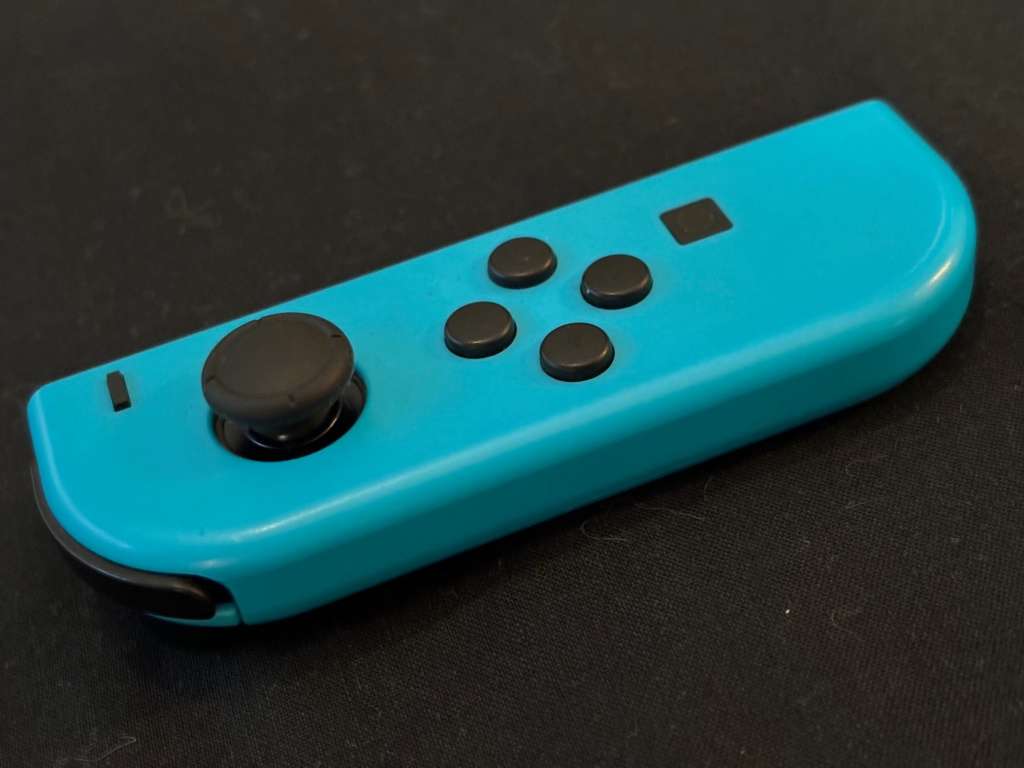 neon blue Left Joy-Con controller for Nintendo Switch with strap