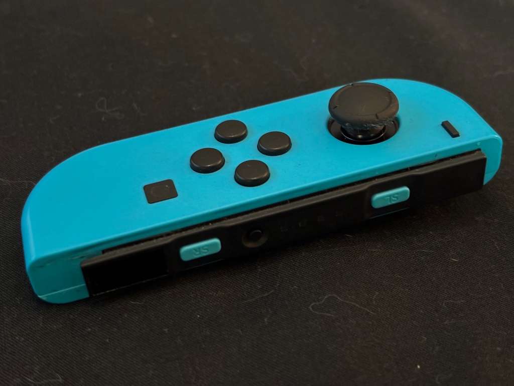 neon blue Left Joy-Con controller for Nintendo Switch with strap
