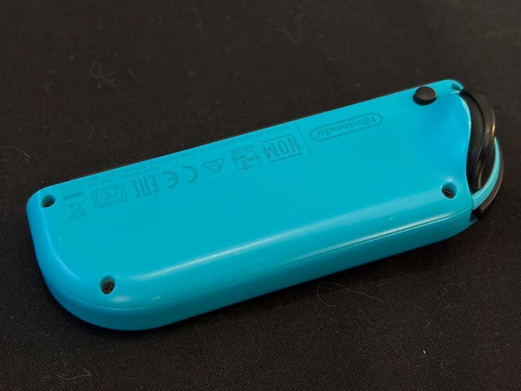 neon blue Left Joy-Con controller for Nintendo Switch with strap