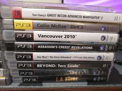 Sony Playstation 3 Slim Console (PS3), Controller and 27 games