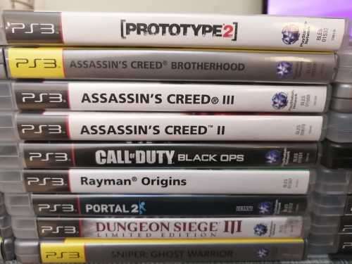 Sony Playstation 3 Slim Console (PS3), Controller and 27 games