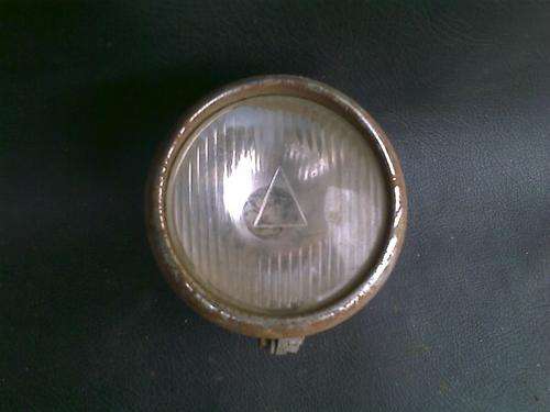 very old bike light maybe bicycle too. very rusted.