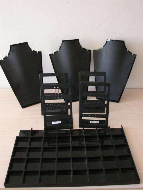 Black plastic jewellery displays.