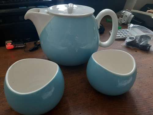 Continential designers tea pot and 2 holders