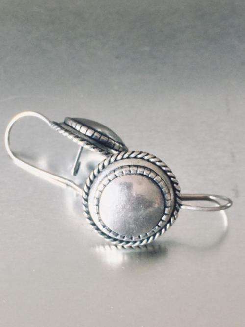LOVELY ROUND BURNISHED SILVER EARRINGS FROM MIGLIO.