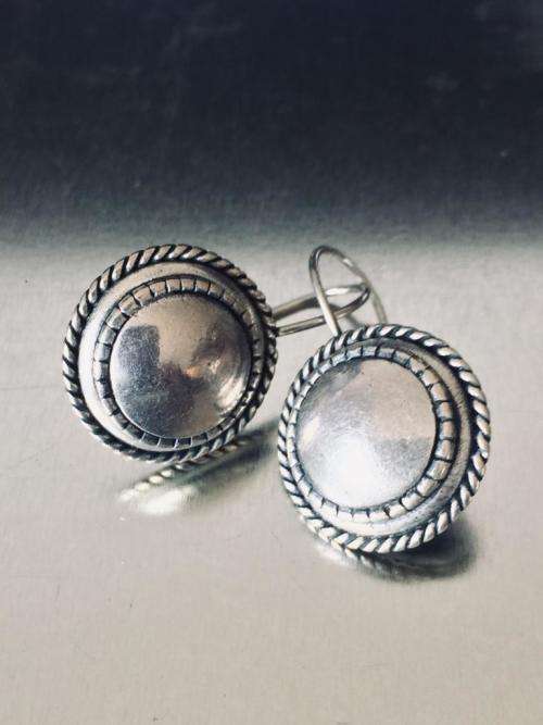 LOVELY ROUND BURNISHED SILVER EARRINGS FROM MIGLIO.