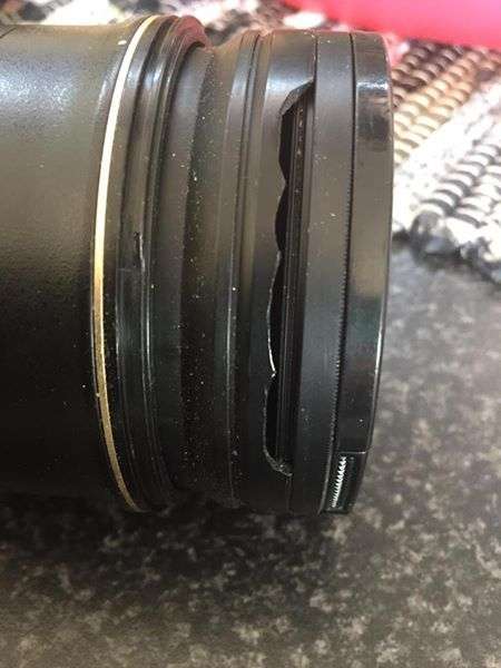 Nikon 24-70mm f2.8 with both lens caps and hood.