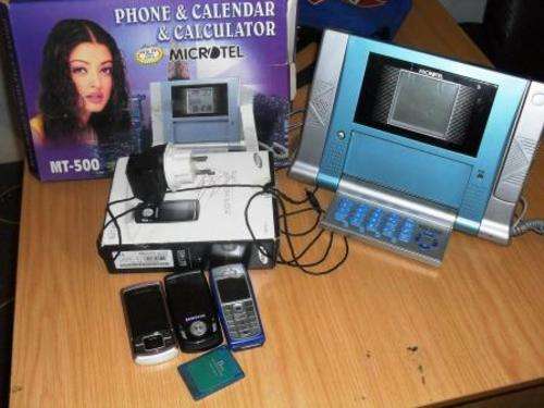 **LOT OF PHONES, 3 CELL PHONES,1 LANDLINE, 1 PS 2 MEMORY CARD*****