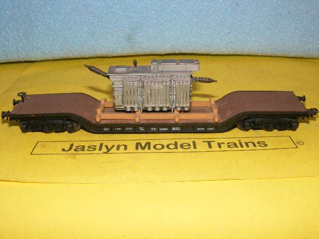 Roco HO Depressed wagon with transformer load.