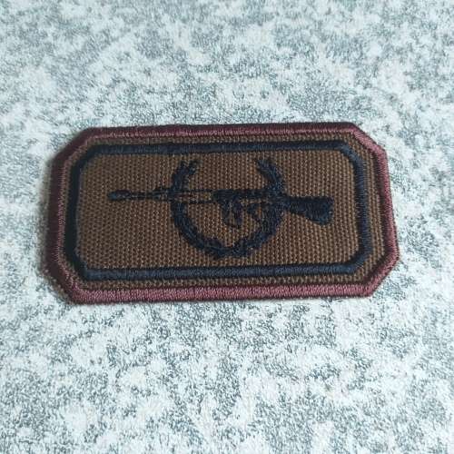 Sniper nutria breast badge