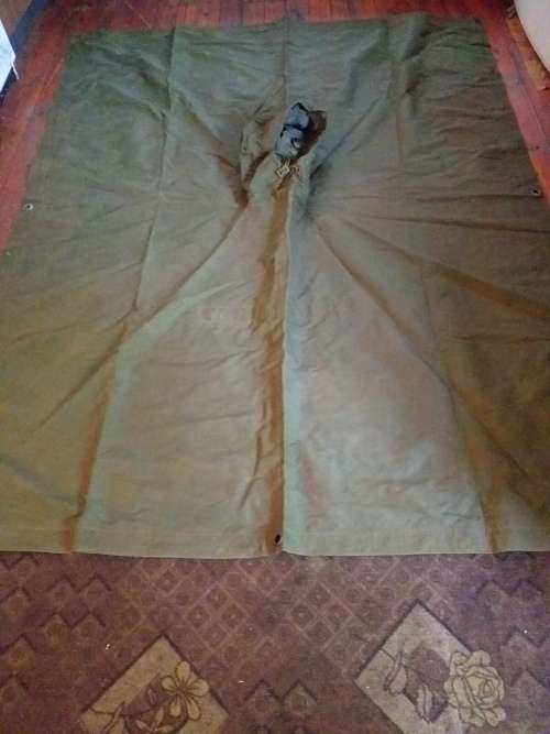 Poncho/Ground sheet with carrier and kidney pouches.