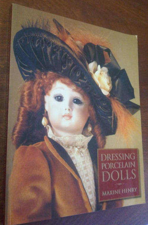Dressing Porcelain Dolls  by   Henry, Maxine