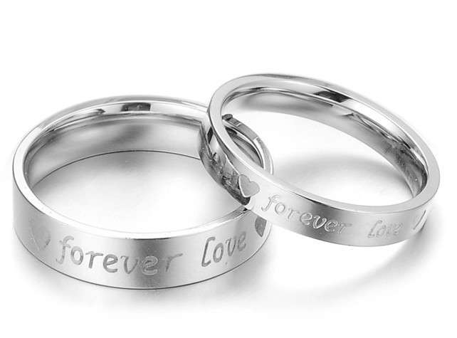 Titanium steel Forever Love couples rings, Bid on the womans ring and receive the Men's ring free.