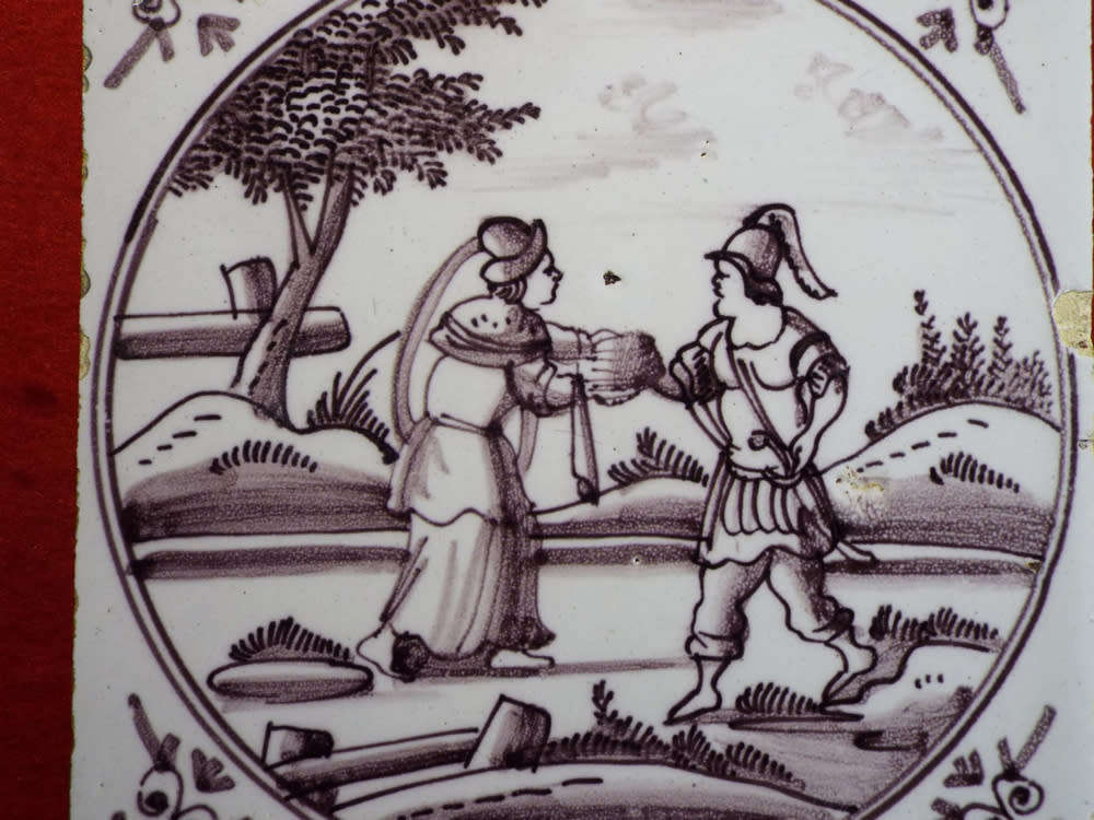 A rare `Bristol` manganese coloured `Delft` wall tile Ref.#CL-9